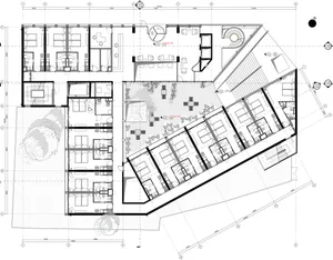 Black and white architectural drawing of an office layout with open spaces, cubicles, and conference rooms.