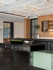 A modern restaurant bar with wooden elements and glass fixtures.