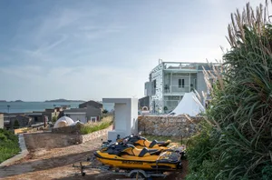 Vacation home resort with metal-clad exterior on a cliffside.