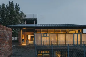 Modern building facade made of brick, steel, and glass materials.