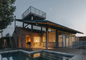 Modern house featuring brick and concrete materials.
