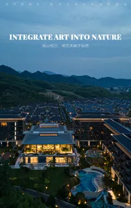 Aerial view of a luxurious mountain resort during dusk, featuring modern buildings with glass facades and a serene pool area 