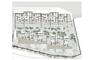Modern apartment building layout with exterior brick walls, balconies, and communal areas.