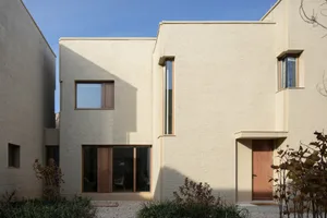 Modern architectural design featuring concrete and glass materials.