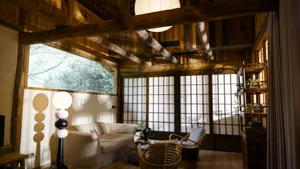 A modern interior living room with wooden floor, furniture, and decor.