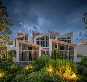 Modern residential building with concrete and glass exterior and interior design.