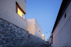 Modern residential building with brick exterior in urban setting