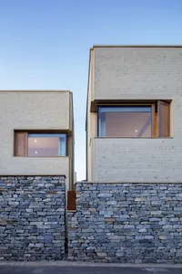 Modern exterior residential house with stone bricks and wooden accents
