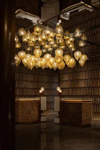 Modern reception desk illuminated by glass pendant lights
