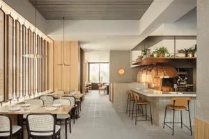 Modern restaurant interior with wooden tables, concrete walls, and a copper dome pizza oven.