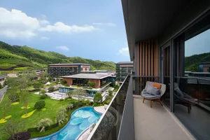 A modern resort with concrete, glass, and wood elements.