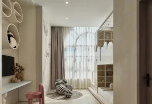 A modern bedroom featuring white walls, a white chair with black and white stripes, and a white bunk bed with circular shelve