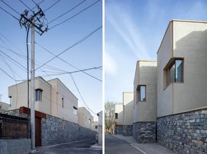 Modern architecture featuring a stone exterior in a residential setting.