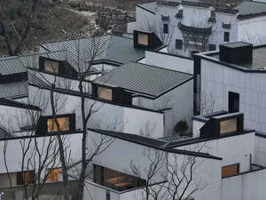 Modern building with metallic roof and glass windows