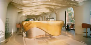 A modern coffee shop featuring a metallic counter design