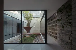 Modern interior space featuring glass and brick materials