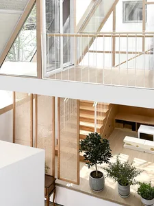 Modern living room with wooden flooring, minimalist design, and glass balcony.