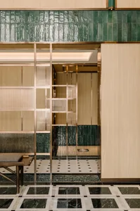 Modern retail storefront with a metal perforated panel facade