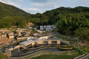 Modern, residential building constructed with concrete and glass materials.