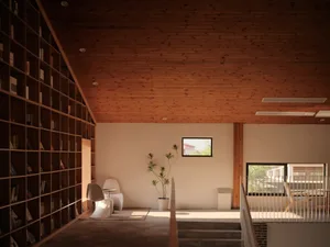 A minimalist living room with wood elements and a potted plant.