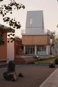 Modern residential house with wooden and metallic exterior.