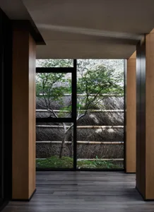 A view through a wooden window in an industrial-style room.