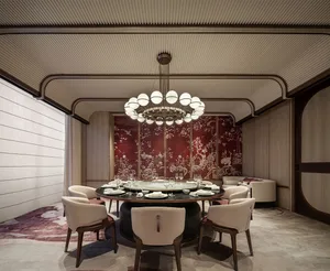 A luxurious restaurant interior featuring a round dining table with marble top, surrounded by upholstered chairs and a decora