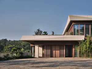 Modern building with wooden and glass elements.