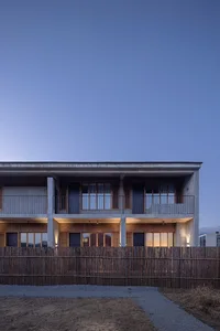 Modern building exterior made of stone with a minimalist design.