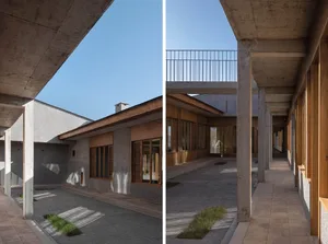Modern industrial architecture interior with concrete walls and wooden accents.