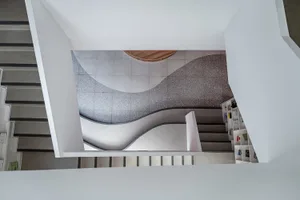 Modern interior featuring concrete walls and flooring.