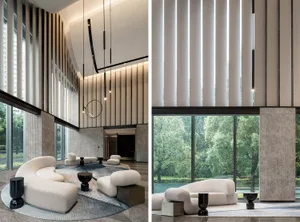 Modern lobby interior featuring white couches and contemporary design elements.