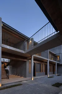 Modern architectural design featuring concrete and wood materials.