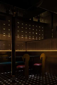 A modern industrial restaurant interior with wooden furniture and lighting.