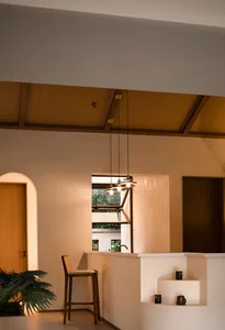 Modern, minimalist coffee shop with metallic accents and an open-plan design.