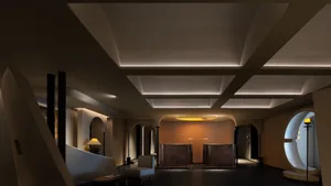 Modern lobby featuring concrete and marble finishes with a conference table.