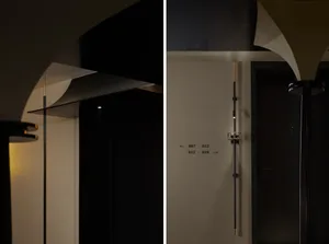 Exterior view of a minimalist hotel suite showcasing metal and wood detailing.