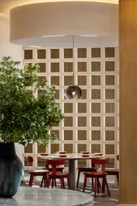 An industrial-style restaurant interior featuring wooden elements and a modern design.