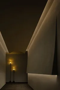Modern interior design featuring a corridor with minimalist lighting and illumination techniques.