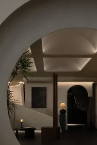 Modern minimalist hallway with concrete walls and stone flooring
