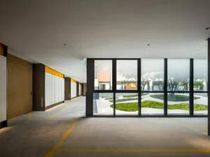 An image of a modern minimalist residential interior with a concrete floor.
