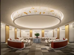 Modern restaurant interior with white pine fluted floor tiles, curved seating areas, and a central round plant table.