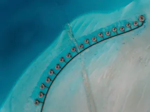 Aerial view of a residential development along the water's edge.