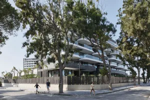 Modern apartment buildings with concrete and glass materials, featuring balconies and greenery.