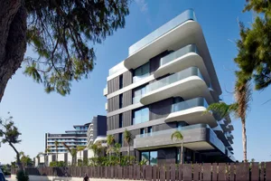 Modern apartment buildings with glass and concrete exteriors
