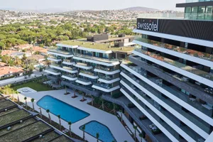 Modern residential condominiums featuring concrete and glass architecture