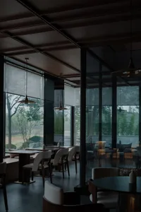 Modern cafe interior with glass and concrete materials