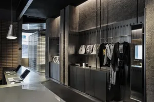 Industrial retail storefront with metal finishes and concrete elements