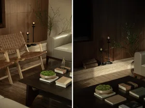 A modern living room with a wooden coffee table, leather armchair, and a white sofa. The room features candle holders and log