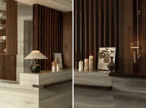 A modern lobby interior with a wooden plank accent wall and marble countertop.